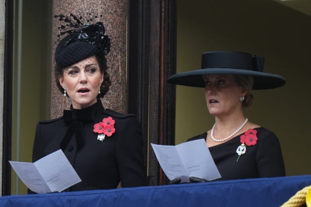 Kate and Sophie singing a hymn during the service