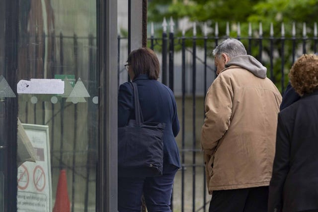 William Lloyd-Lavery (right in beige coat) arriving at Belfast Crown Court