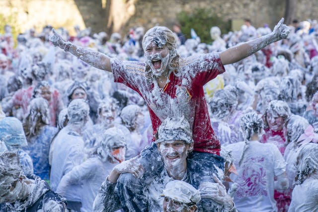 Students covered in shaving foam