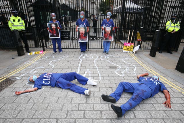 NHS workers stage a die-in outside Downing Street