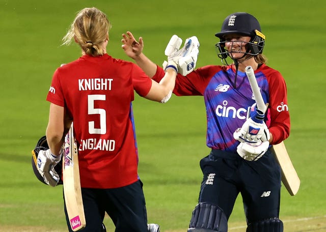 Danni Wyatt (right) and Heather Knight celebrate victory in the final match and the series