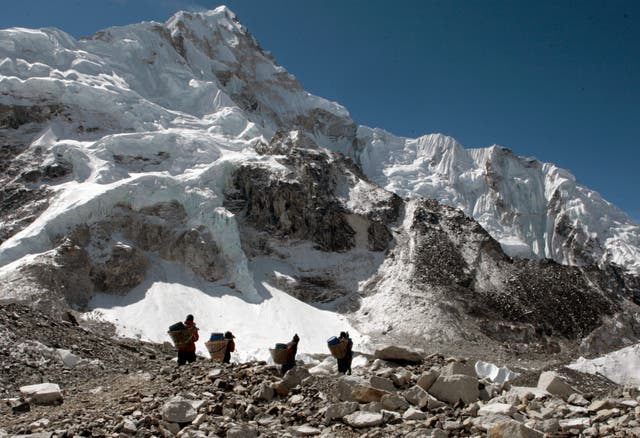 Porters transport supplies around Everest base camp 