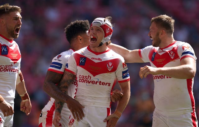 St Helens players celebrate Theo Fages' opening try