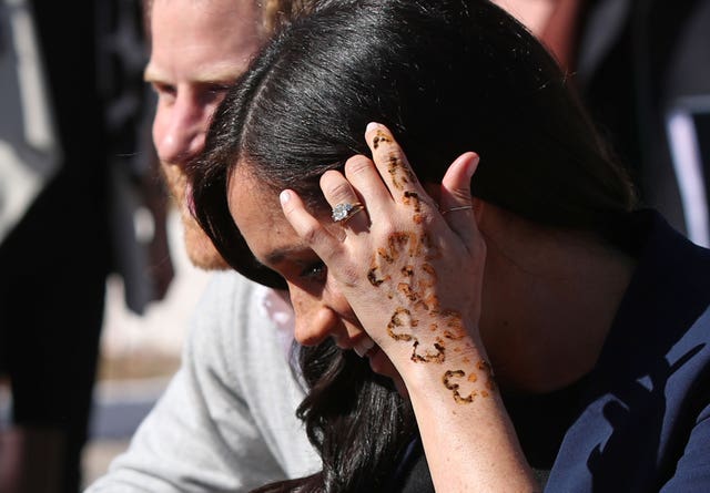 The Duchess of Sussex proudly shows off her temporary tattoo