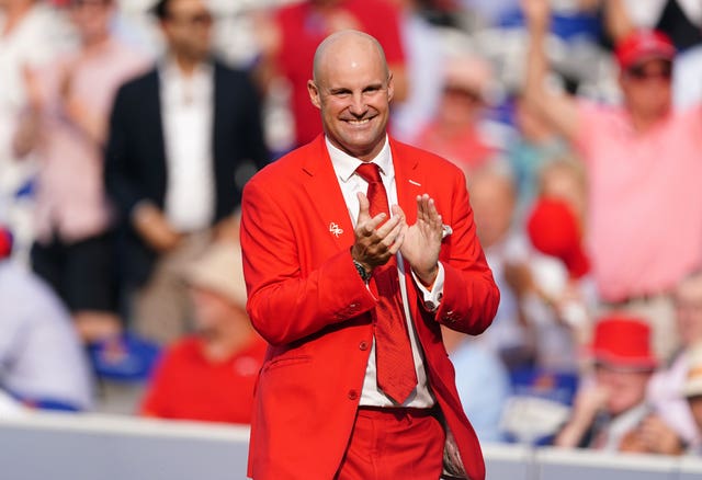 Sir Andrew Strauss wearing his 'Red for Ruth' suit applauds during day two of the second Ashes Test at Lord’s last summer