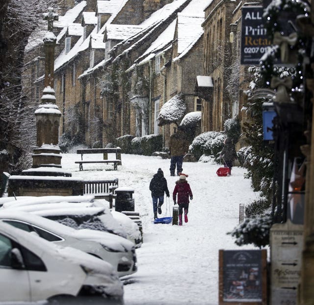 People sledge in the snow 