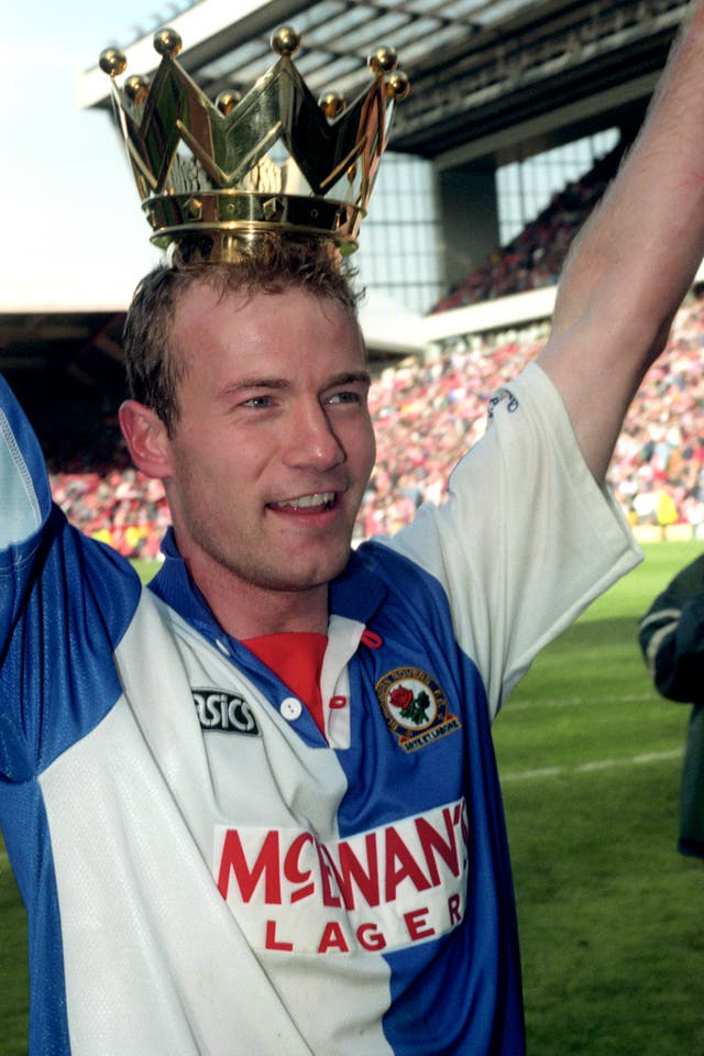Alan Shearer wears the crown from the Premier League trophy after his 34 goals led Blackburn to the title