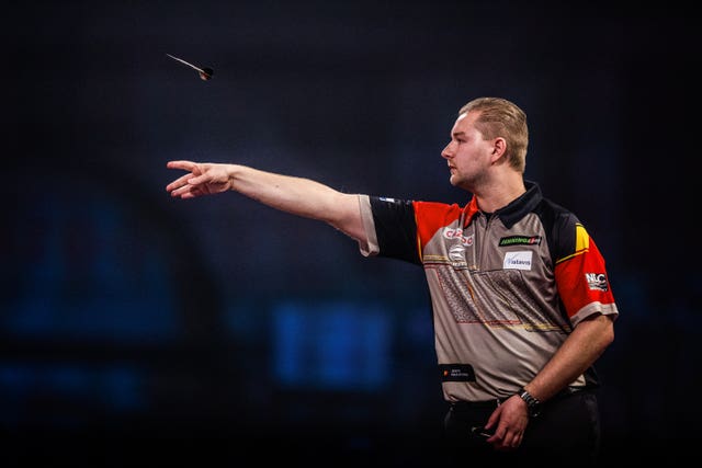 Dimitri Van den Bergh in action at the World Darts Championship