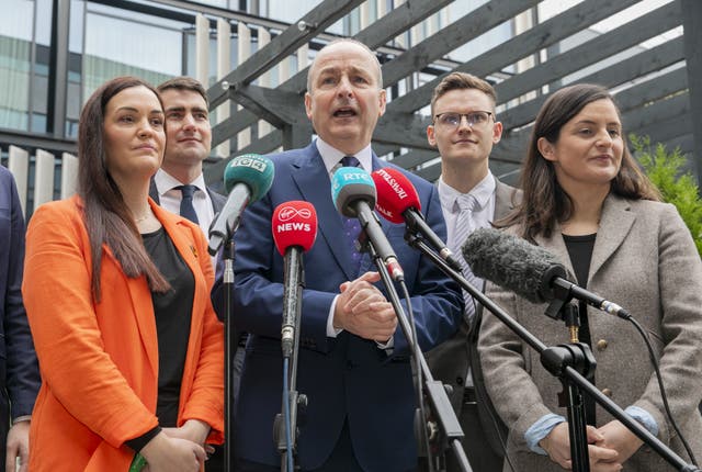 Micheal Martin speaking into a number of microphones