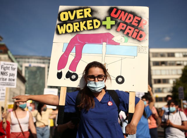 NHS workers march from St Thomas’ Hospital to Downing Street, London, to demand a pay rise