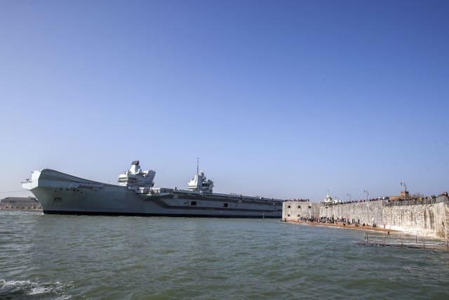 The Royal Navy aircraft carrier HMS Queen Elizabeth leaves Portsmouth Naval Base in Hampshire as it sets sail for exercises at sea 