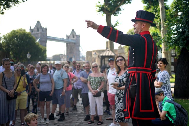 Yeoman Warder Barney Chandler leads a tour of the tower