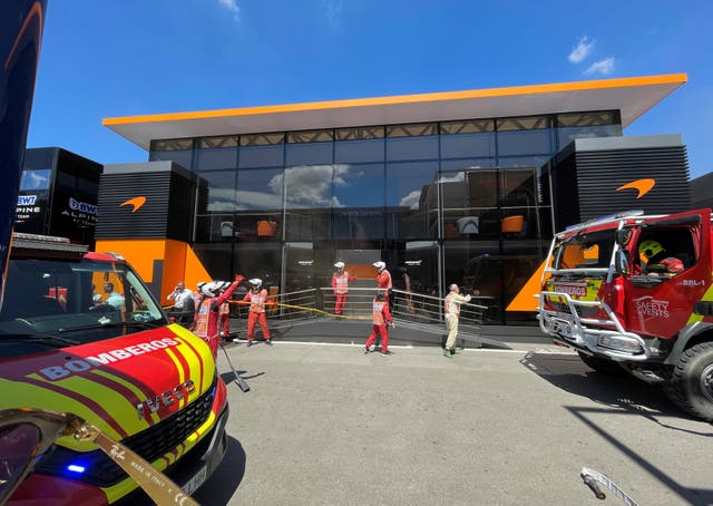 Emergency services tackle a fire at McLaren's hospitality suite