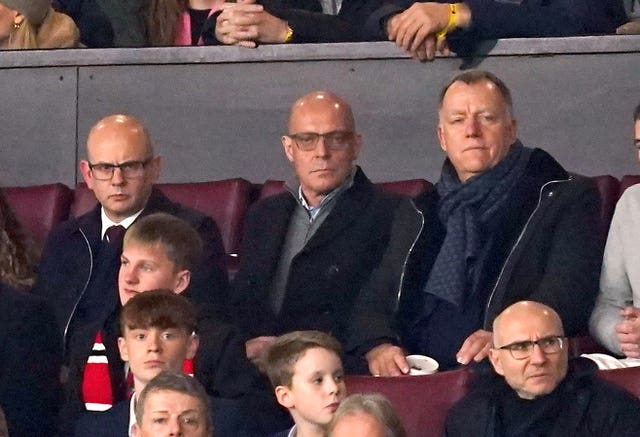 Sir Dave Brailsford (centre) watched from the stands