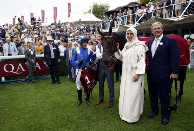 Jockey Jim Crowley (left), with Sheikha Hissa Hamdan Al Maktoum and trainer William Haggas  following his winning ride on Baaeed in the Qatar Sussex Stakes at Glorious Goodwood