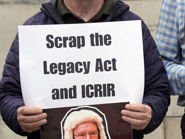 A protester outside the Royal Courts of Justice in Belfast , where judgment is due in September 2024 