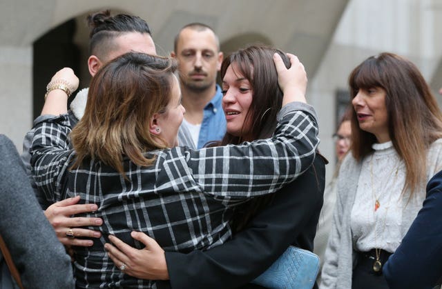 Samantha Collot (centre), a friend of Laureline Garcia-Bertaux, is comforted by friends outside the Old Bailey 