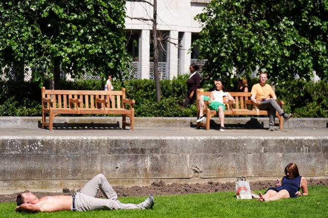 People enjoying the hot weather near St. Paul’s Cathedral in London