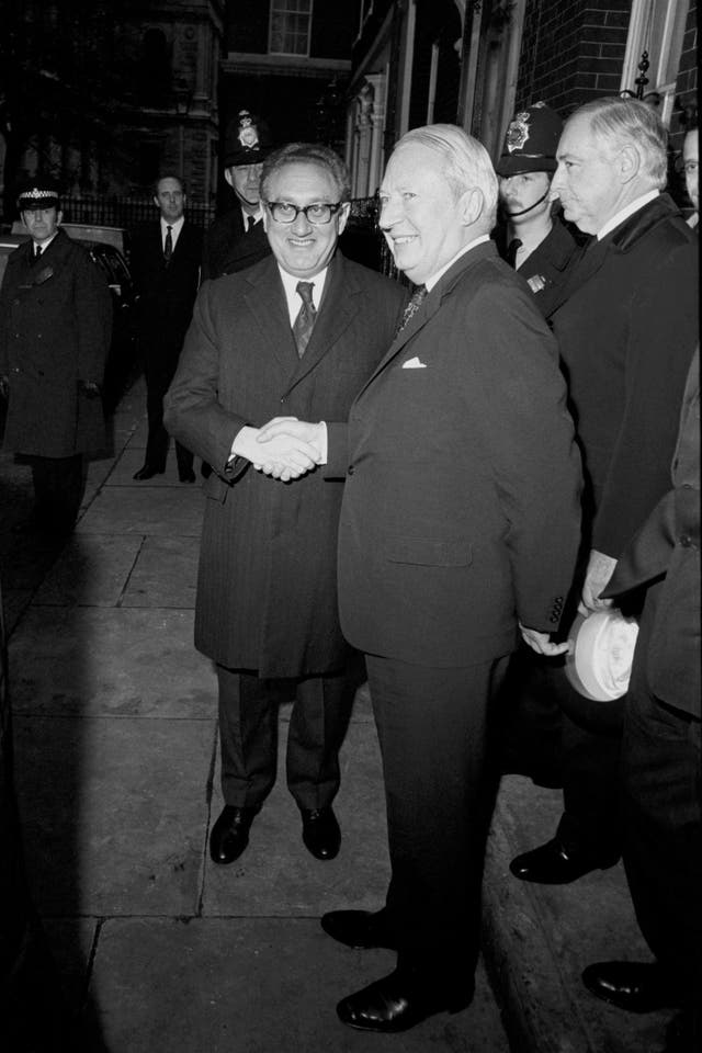 Mr Kissinger shakes hands with then-prime minister Ted Heath in 1973 after a working lunch at 10 Downing Street