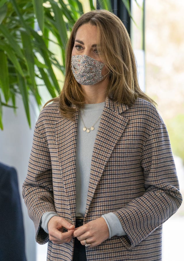 Kate wore a face mask for a visit to the university. Arthur Edwards/The Sun