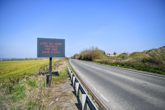 A matrix road sign on the A367 into Bath advises motorists to stay at home