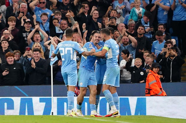 Jack Grealish (centre) celebrates after scoring Manchester City's fourth goal