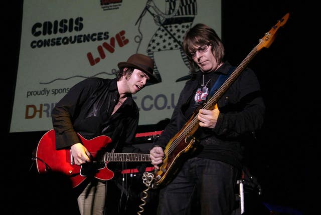Rourke, right, on stage with Gaz Coombes of Supergrass during a charity concert in London