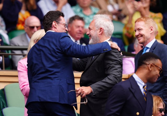 Hugh Jackman hugging Sir Sam Mendes