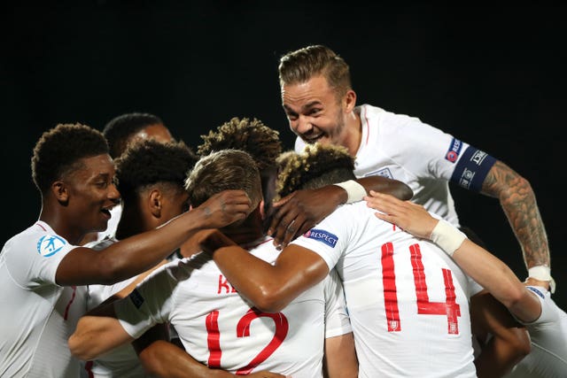 Jonjoe Kenny (back to camera) celebrates scoring England's third goal