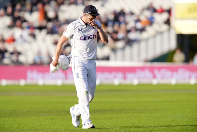 Mark Wood appears dejected as he leaves the field