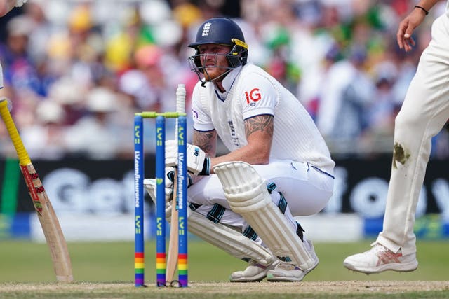 Ben Stokes reacts after being struck with the ball 
