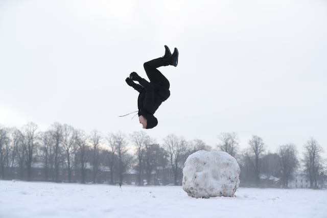 Jack Austin does a backflip off a snowball 