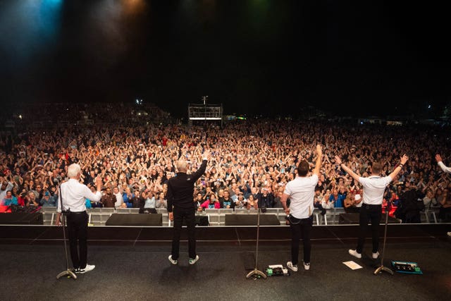 Status Quo thank the crowd after performing at Vivary Park in Taunton 