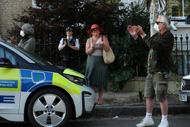 Residents clap in the north London street where Prime Minister Boris Johnson’s top aide Dominic Cummings lives