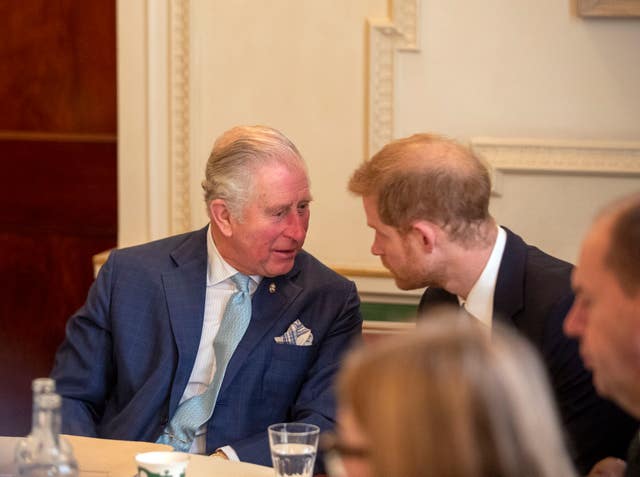 Harry and Charles deep in conversation at a violent youth crime forum in 2018