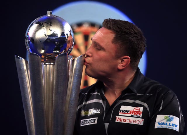 Gerwyn Price kisses the trophy after winning the PDC World Darts Championship