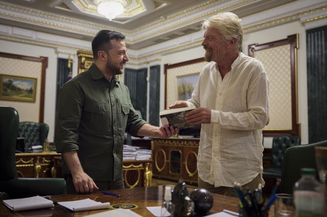 Handout photo issued by Ukrainian Presidential Press Office of Ukrainian President Volodymyr Zelensky during his meeting with Sir Richard Branson in Kyiv, Ukraine