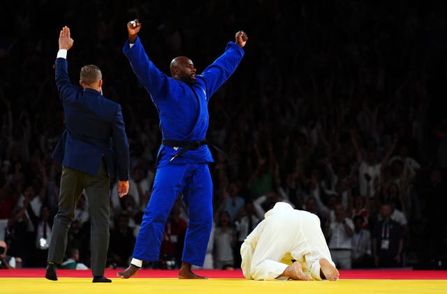 France’s judoka Teddy Riner celebrates victory over South Korea’s Kim Minjong