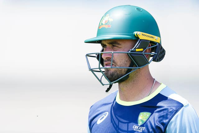 Jake Weatherald looks on while wearing his Australia helmet.