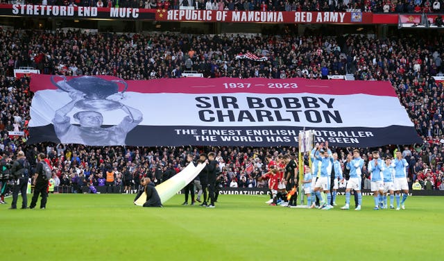 A giant banner in tribute to Sir Bobby Charlton before the Manchester derby