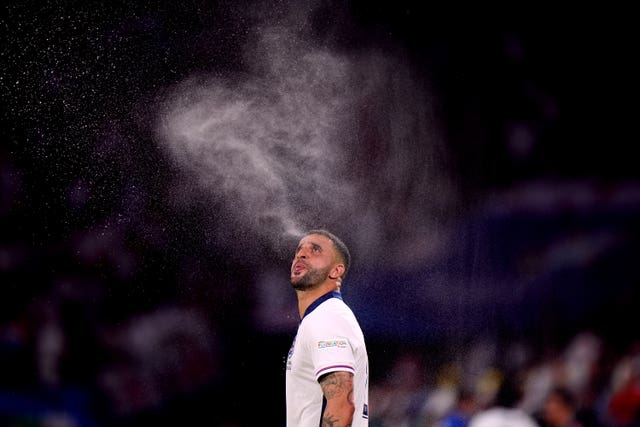 Kyle Walker spits out a jet of water ahead of England's Euro 2024 match against Slovenia