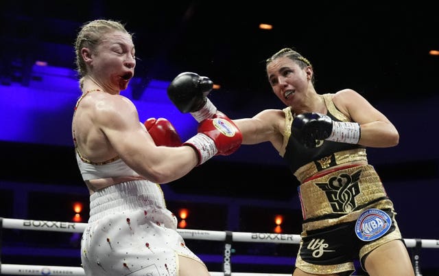 Stephanie Pineiro (right) catches Lauren Price with a punch