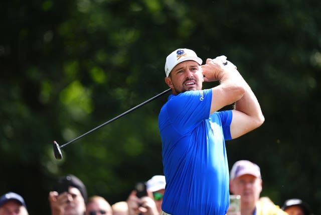 Bryon DeChambeau tees off