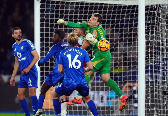 Leicester goalkeeper Mads Hermansen punches into his own goal while being challenged by Tomas Soucek, with the goal disallowed