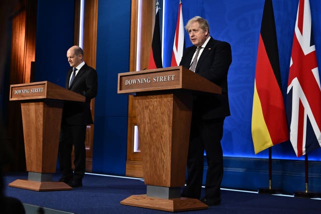 Boris Johnson (right) and German Chancellor Olaf Scholz during a press conference in the Downing Street briefing room