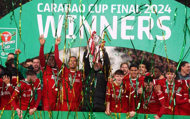 Liverpool manager Jurgen Klopp lifts the trophy after winning the Carabao Cup final at Wembley Stadium