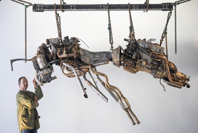 Joe Rush with his sculpture of a bee, which is part of his Unnatural exhibition (Ben Birchall/PA)