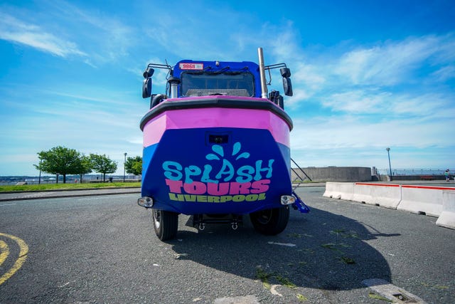 Head-on shot of a blue and pink amphibious vehicle