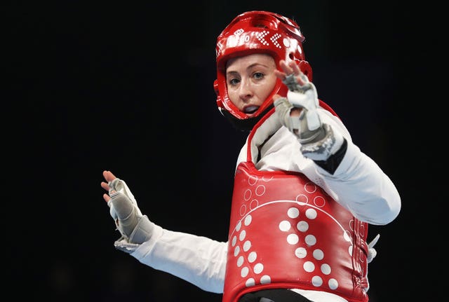 Jade Jones in action, arms outstretched. 