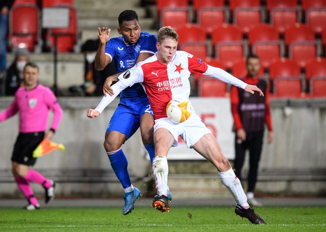 Alfredo Morelos challenges for the ball